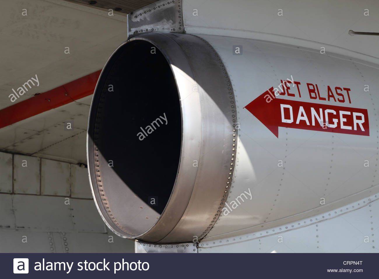 a-close-up-of-the-engine-exhaust-with-warning-sign-on-an-old-us-navy-CRPN4T.jpg