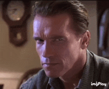 arnold-schwarzenegger-straight-face.gif