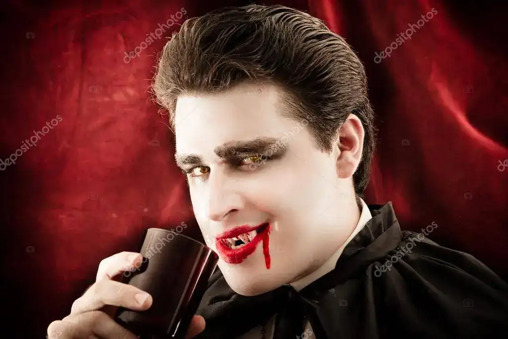 depositphotos_13325425-stock-photo-male-vampire-drinking-blood-smiling.webp