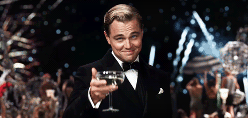 gatsby-cheers-leonardo-dicaprio-drink-fireworks.gif