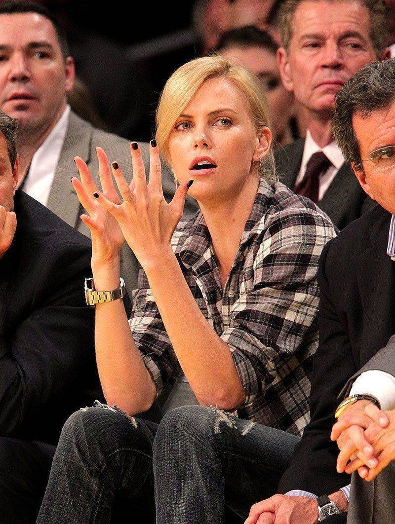harlize-Theron-Rolex-DEEP-SEA-Lakers-Game-Clapping.jpg