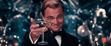 leonardo-dicaprio-glass-toast-tuxedo-great-gatsby.gif