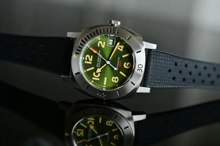 Nivada-Grenchen-Depthmaster-Green-Numerals-Date-14103A09-value-proposition-dive-watch-hands-o...webp