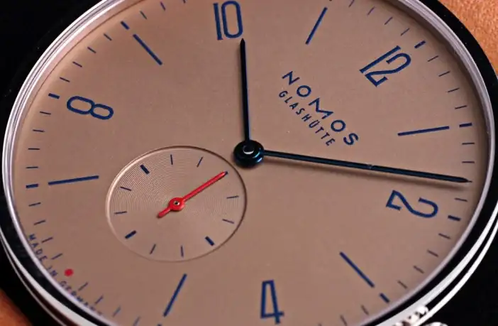nomos-tagente-sg-salmon-dial.webp