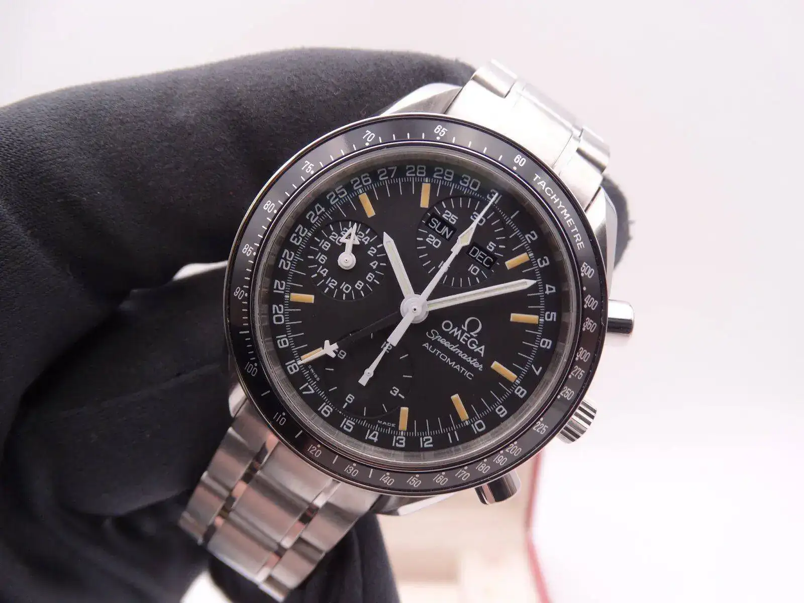 omega speedmaster automatic triple date