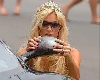 paris-hilton-getting-out-of-car.webp