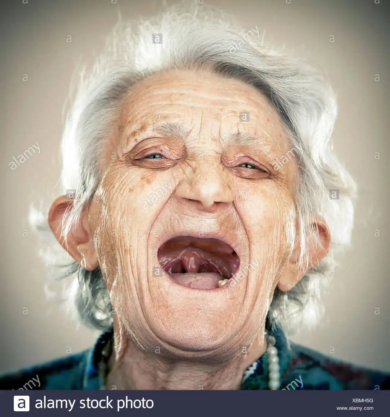 rtrait-of-an-elderly-lady-laughing-out-loud-XBMH5G.webp