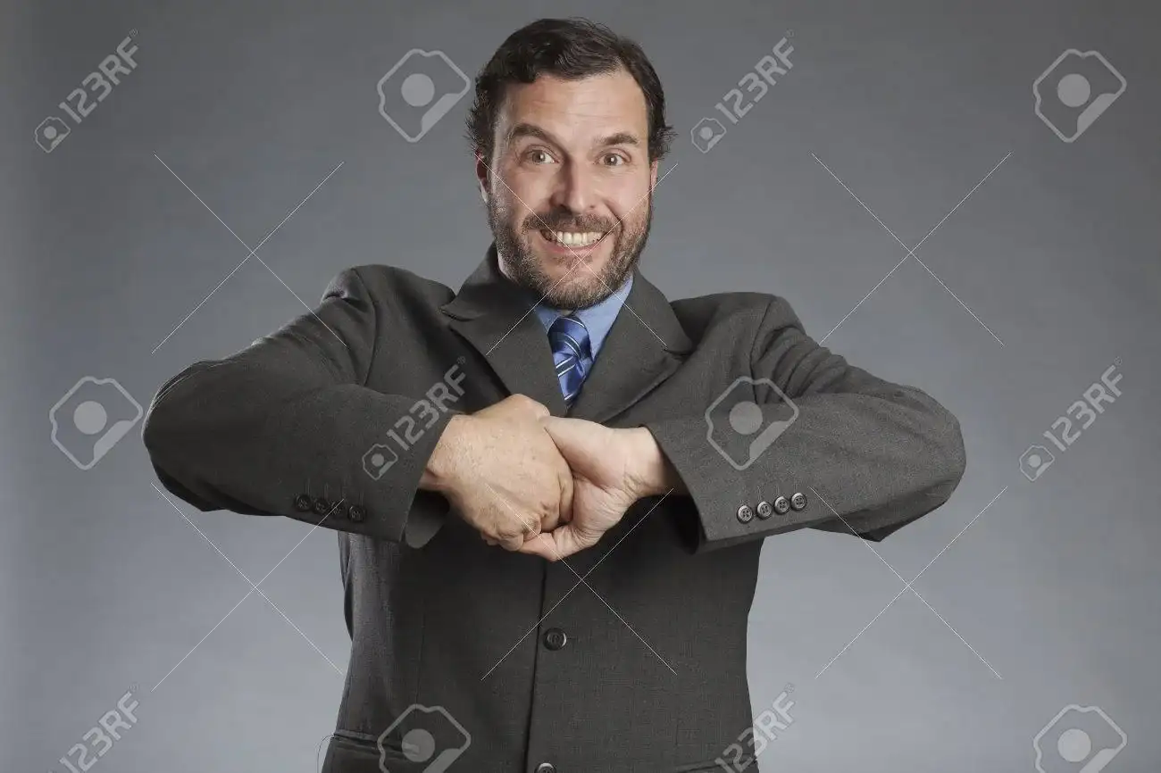 shaking-hands-with-himself-against-gray-background.webp