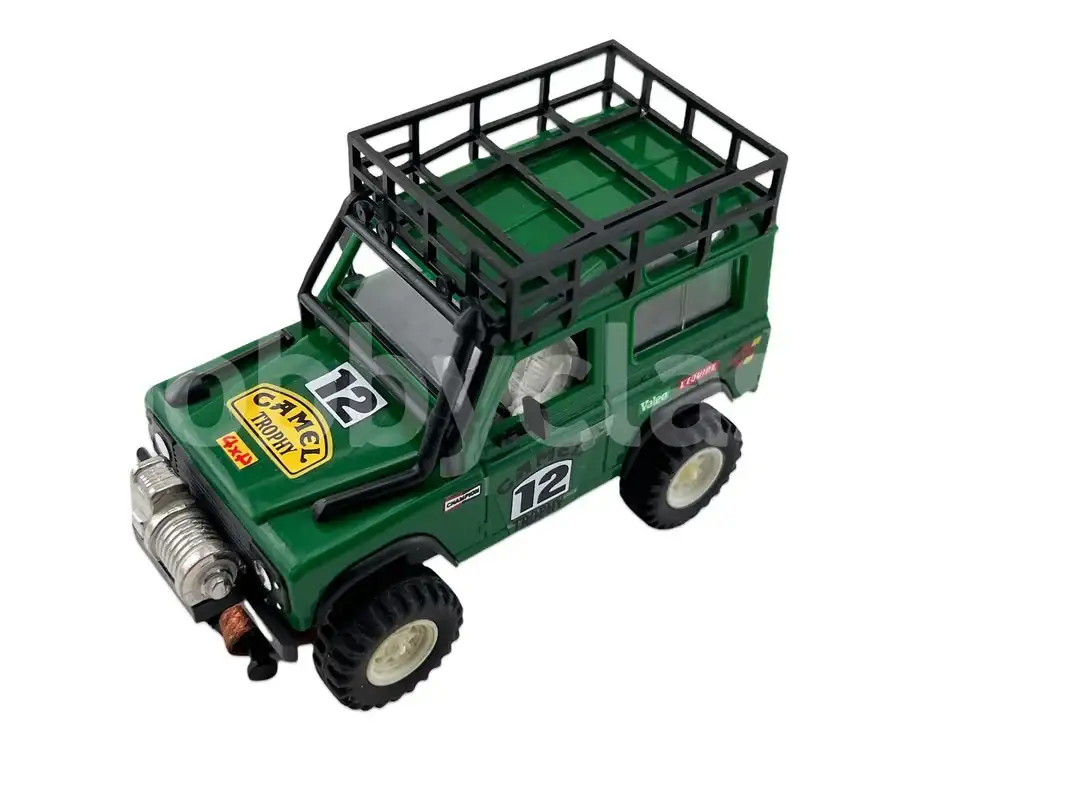 sts-land-rover-dark-green-camel.webp